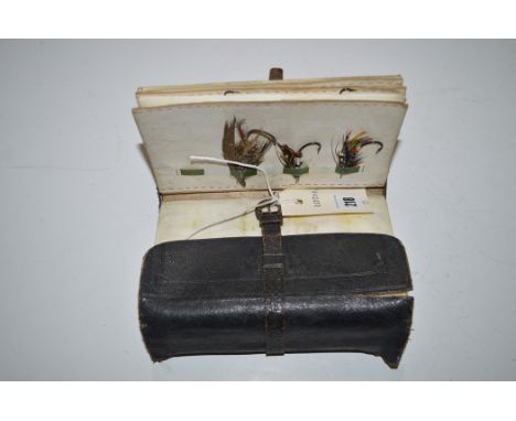 Army and Navy Co-operative Society Ltd., a Vintage blue leather fly and cast wallet, containing a selection of Vintage gut ey