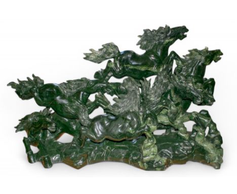 A huge nephrite sculpture of eight horses on a wood stand Bought at Asprey and with a signed Asprey valuation. To be sold wit