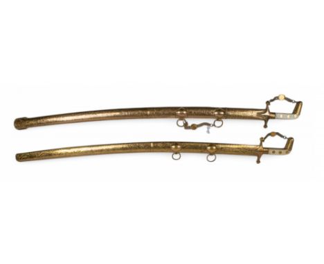 19th century A rare pair of presentational Omani gold cased swords, finely engraved shaft and hilt with foliate decoration, w