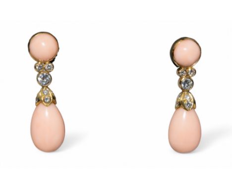 Garrard A pair of angel skin coral, diamond and 18k gold pendant earrings. A circular coral cabochon top with trefoil diamond