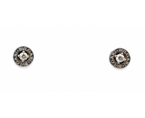 Bulgari A pair of 18k white gold and diamond ear studs, each earring set to the centre with a single brilliant cut diamond, B