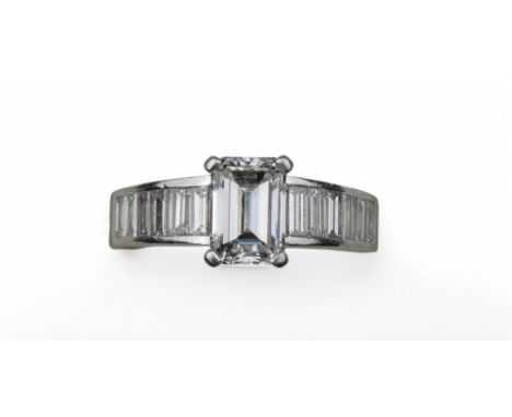 Asprey, Londonc. 2000sAn impressive emerald cut diamond and baguette cut diamond ring. Set to the centre with an emerald cut 