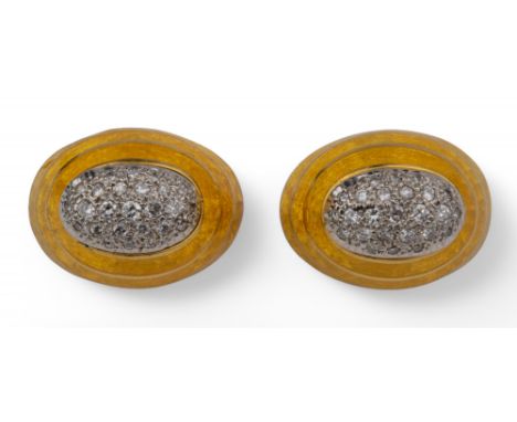 1970s A pair of 18 carat gold, diamond and yellow enamel ear clips. Of high-domed bombé form, with brilliant yellow enamel bo