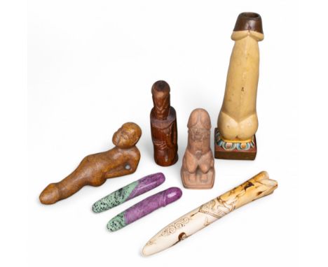 A group of phallic ornaments To include: [a] A terracotta male nude in phallic shape [b] Tahiti, A red wood carving of Oro (?