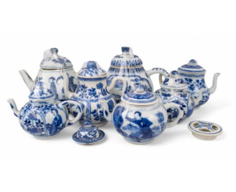 Chinese, Kangxi period (1662-1722) and later 18th century A collection of seven small blue and white teapots with two spare l