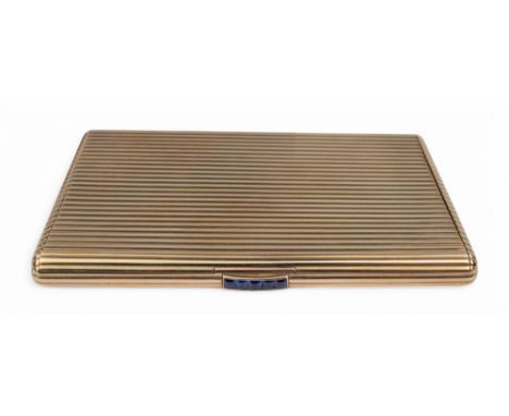 Cartier, London A fine 9 carat gold ribbed slimline cigarette case with calibré cut sapphire push piece.&nbsp; Hallmarked Lon
