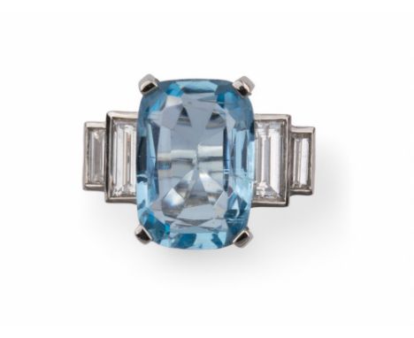 Contemporary An attractive aquamarine and diamond ring. The rectangular cushion faceted mixed cut aquamarine weighing approxi