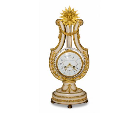 French 19th century Festeau Le Jeune A gilded ormolu and white marble mantle clock in the shape of a lyre, with a sun burst m