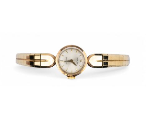 1950s A Rolex Precision 9k gold ladies' bracelet wrist watch. The circular dial brushed silver on a tapering brick link flexi