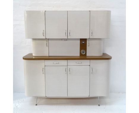 RETRO 1960'S FRENCH KITCHEN UNITin three sections, the upper with a pair of cupboard doors flanked by shaped cupboard doors, 