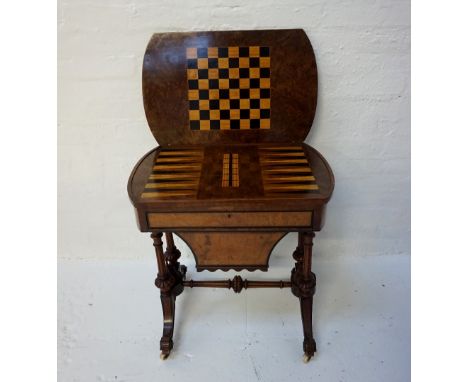 MID VICTORIAN BURR WALNUT AND INLAID COMBINATION GAMES/WORK TABLEwith a shaped fold over rotating top revealing a chess/draug