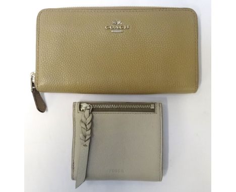 NEW AND UNUSED COACH LEATHER WALLETmushroom coloured and with original protective bag; together with a new and boxed Fossil l