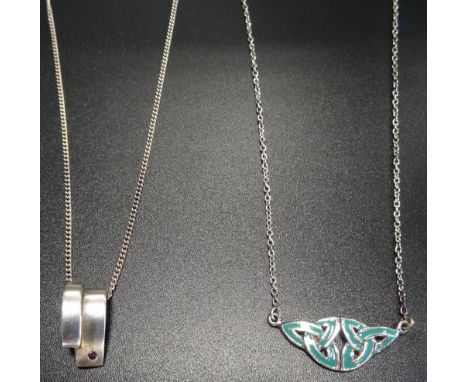 HERITAGE BY KIT HEATH TURQUOISE COLOURED ENAMEL DECORATED SILVER PENDANTof double triquetra design; together with a ruby set 