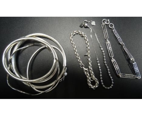 SELECTION OF EIGHT SILVER BANGLES AND BRACELETSincluding a Machintosh style bracelet and a wavy bangle (8) 