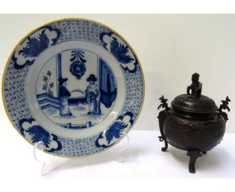 19th CENTURY JAPANESE BLUE AND WHITE GLAZED PLATEwith central figural panel within floral and motif decorated border, painted