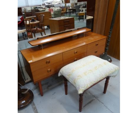 SCHREIBER TEAK DRESSING CHESTthe raised mirror back above a shaped shelf with an arrangement of six drawers below, standing o