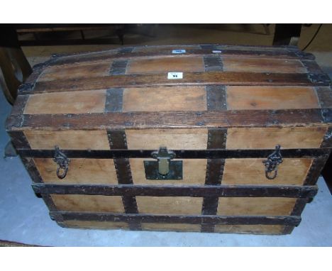 A 19th Century Oak and Metal Bound Travel Trunk with doomed top. 