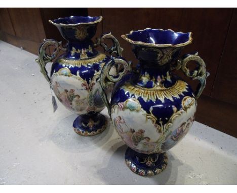 A Pair of Late Victorian Vases, with transfer print decoration on a blue ground.