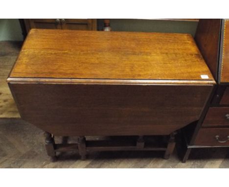 A 3' oak gate leg dining table on barley twist legs 