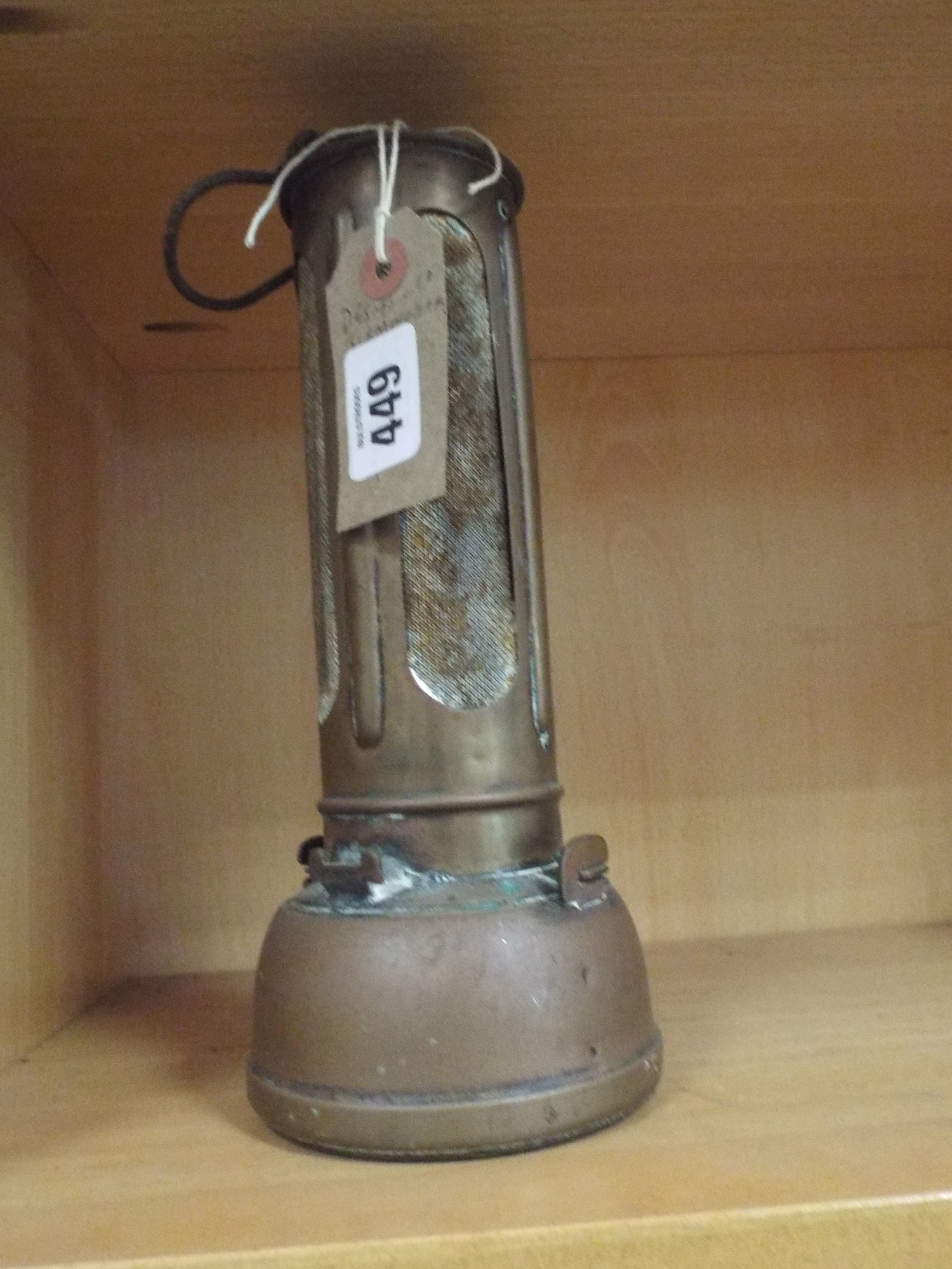 A brass sump heater by Desmo of Birmingham complete with steel hook and