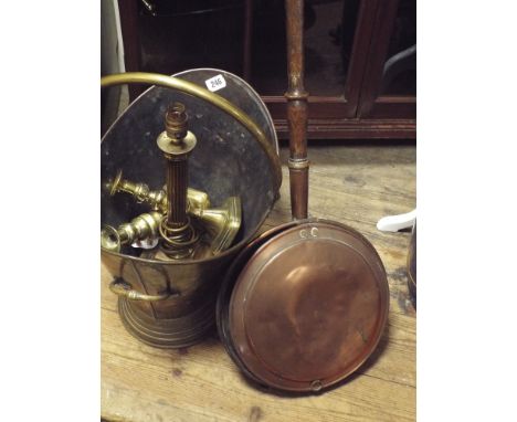 A brass coal bucket, table lamp, pair of candlesticks and a copper warming pan 