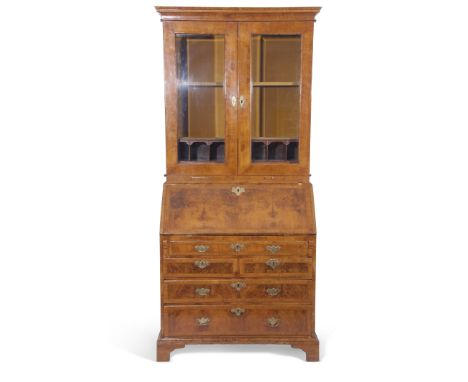 Early Georgian walnut bureau bookcase, the top section with two glazed doors with twin shelves and arch pigeonholes inside, w