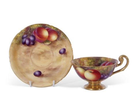 Royal Worcester cup and saucer, both decorated with fruit by Harry Ayrton, signature to cup and saucer, puce factory mark to 