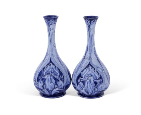 Good pair of early Moorcroft Florian ware vases, the pear shaped bodies with tube lined floral designs in tones of light and 