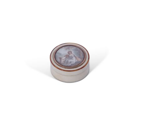 Georgian ivory, tortoiseshell and gold mounted circular snuff box and lid, the lid hand painted with a female scribe seated b
