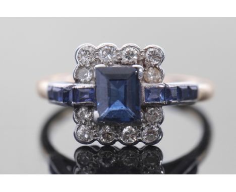 Sapphire and diamond cluster ring in Art Deco style, featuring a rectangular cut sapphire within a surround of twelve small d