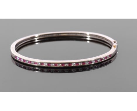 Diamond and ruby hinged bracelet, the top section with alternate small brilliant cut diamonds and round cut rubies, channel s
