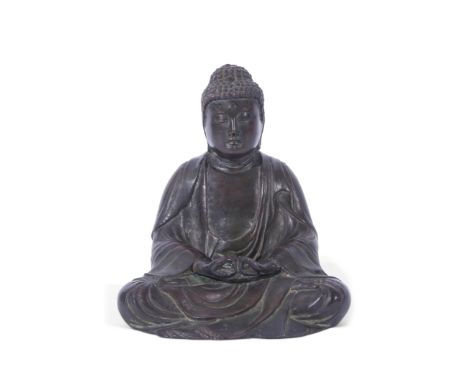 Bronze model of Buddha in typical pose, 19cm high