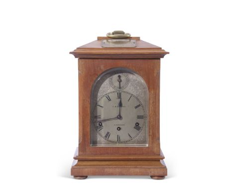 S B Cooper, E. Dereham, early 20th century mahogany cased bracket clock, the architectural case with looped carrying handle a