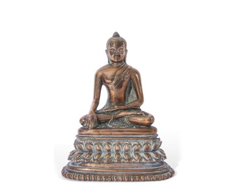 Gilt bronze model of a Buddha in typical pose, raised on shaped base, 15cm high