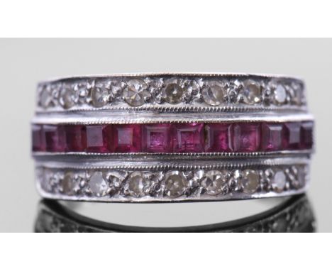 18ct white gold, ruby and diamond half hoop ring, the centre with a row of pave set calibre cut rubies, between two rows of s