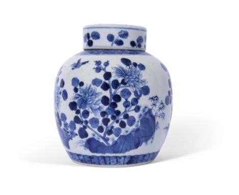 Chinese porcelain jar and cover with blue and white designs of flowers and birds, the cover with similar design, Kangxi mark 