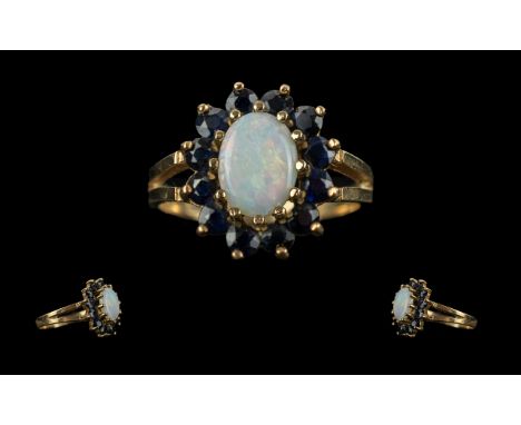 Ladies 9ct Gold - Opal &amp; Garnet Set Ring. Hallmarked for 9ct. Ring Size M - N. Approx Weight 2.6 grams.