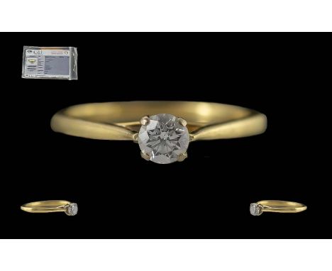 Ladies 18ct Gold Single Stone Diamond Set Ring.  Full hallmark and security code to interior of shank.  With G L Diamond cert