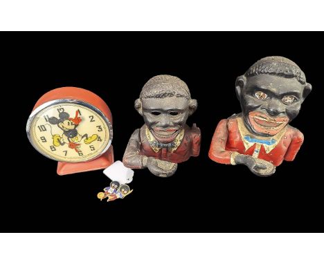 A Mixed Lot to Include two cast money boxes, together with two Robinson's badges and a 1970 Walt Disney Production alarm cloc