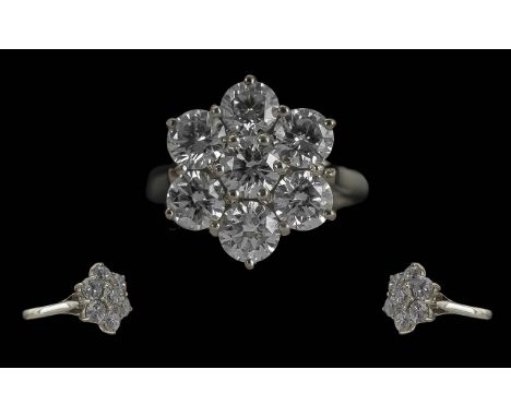 Ladies Stunning 18ct White Gold 7 Stone Diamond Set Cluster Ring, full hallmark to interior of shank, the modern round brilli