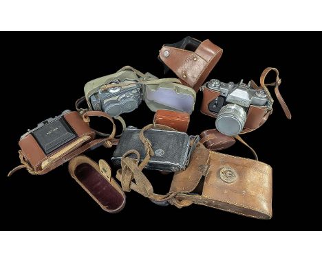 Rolleiflex Grey Hardcase Camera, together with three other vintage cameras.