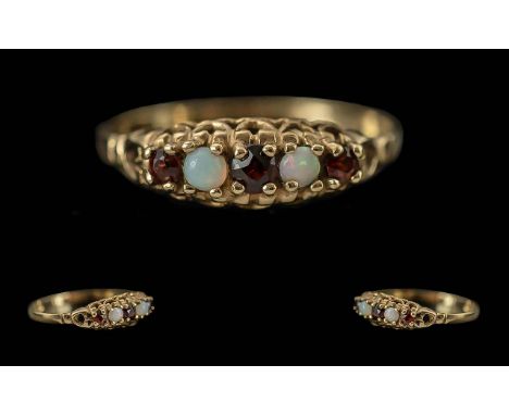 Antique Period Ladies 9ct Gold Garnet &amp; Opal Set Ring, raised setting.  Full hallmark to interior of shank.  The opals of