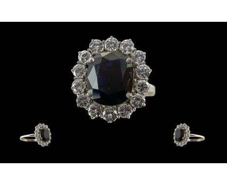 Ladies Stunning 18ct White Gold Diamond and Sapphire Set Dress Ring, hallmark to interior of shank, the large, faceted blue s
