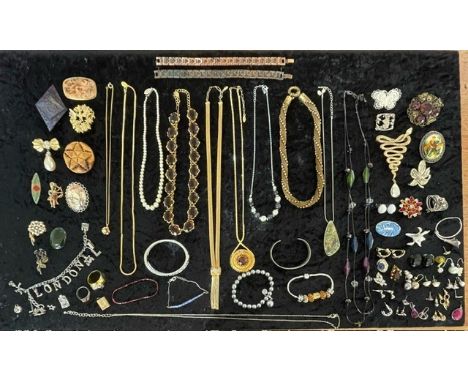 A collection of assorted vintage costume jewellery including brooches, necklaces etc