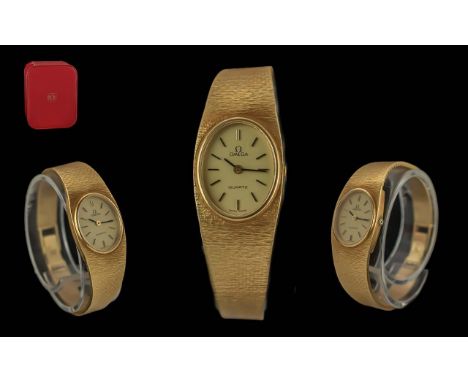 Omega Ladies 18ct Gold Quartz Wrist Watch with Integral Bracelet. Marked 750 - 18ct. Hallmark for 1970's. Weight 41.9 grams.