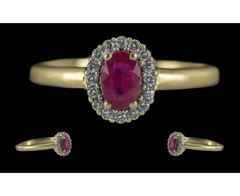 Ladies Attractive 9ct Gold Ruby and Diamond Set Cluster Ring, Full Hallmark to Interior of Shank. The Central Ruby of Good Co