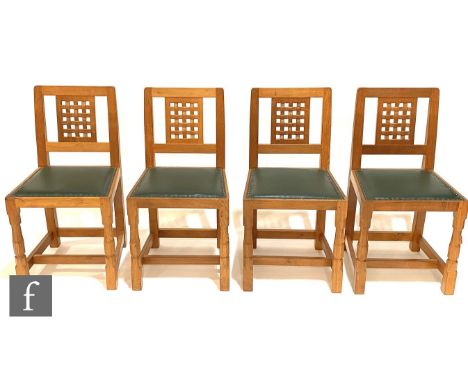 Robert 'Mouseman' Thompson - A set of four late 20th Century oak lattice back dining chairs, with studded green leather seats