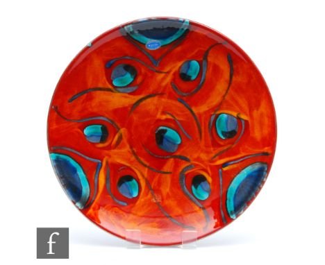 Poole Pottery - A large later 20th Century Living Glaze charger from the Peacock range decorated with blue and green eyes aga
