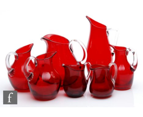 Geoffrey Baxter - Whitefriars - A collection of Ruby glass jugs, various patterns, heights 8.5cm-20cm. (7) 
