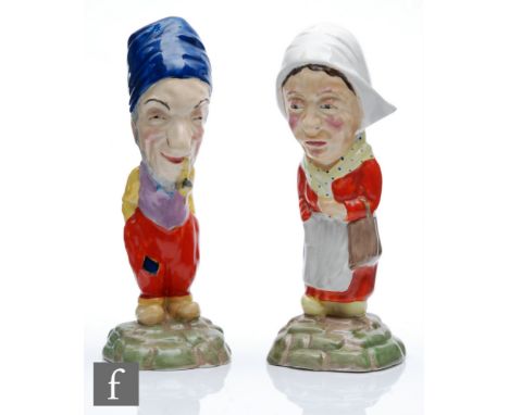 Clarice Cliff - Dutch Couple - A pair of A.J.Wilkinson figures modelled as a Dutch couple in traditional dress picked out in 